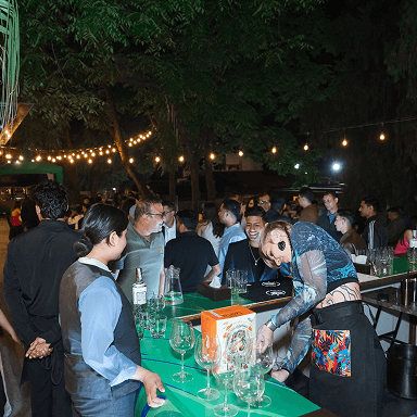 Guests enjoying drinks and conversation at the bar