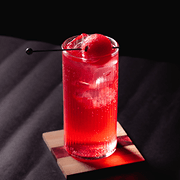 Signature drink presented with garnish